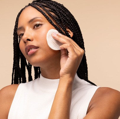 Woman using a pad on her face
