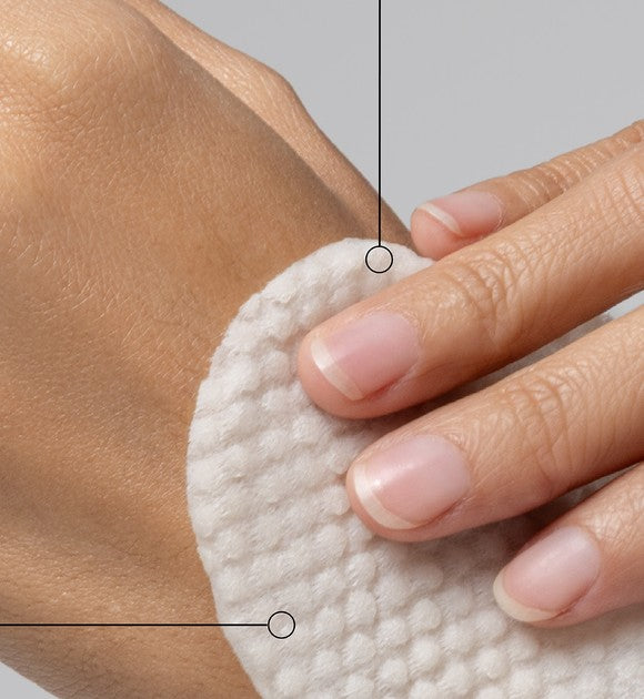 Textured cotton pad touching skin